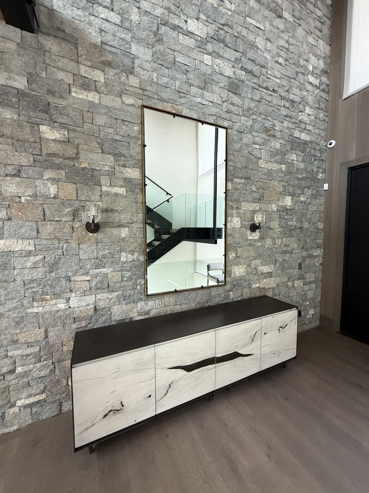 Mirror install &mdash; stone feature wall